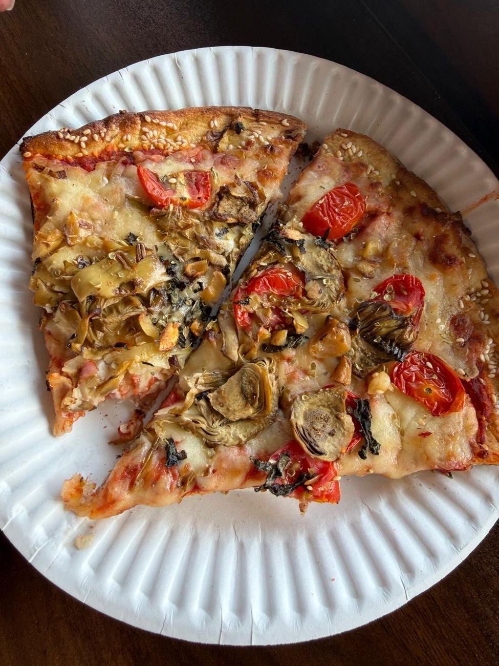 A plated slice with tomato and vegetables